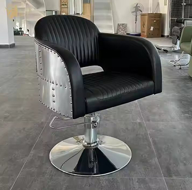 Industrial-Style Black Leather Barber Chair with Riveted Metal Sides and Hydraulic Base
